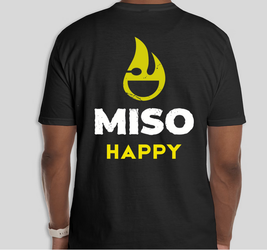 Black t-shirt with yellow Miso Healthy Icon and white Miso Happy text on a gray background