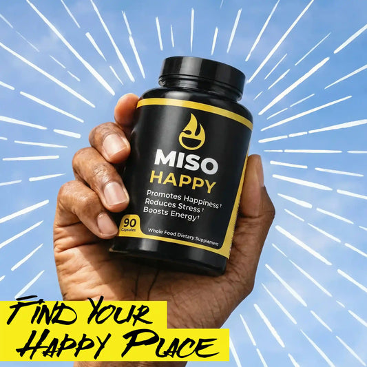 Hand holding a bottle of MISO HAPPY supplements with a blue background and text.